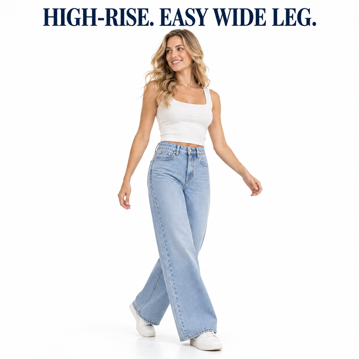 Woman wearing Light Blue high-waist stretch denim wide-leg jeans in a white studio, open walking pose