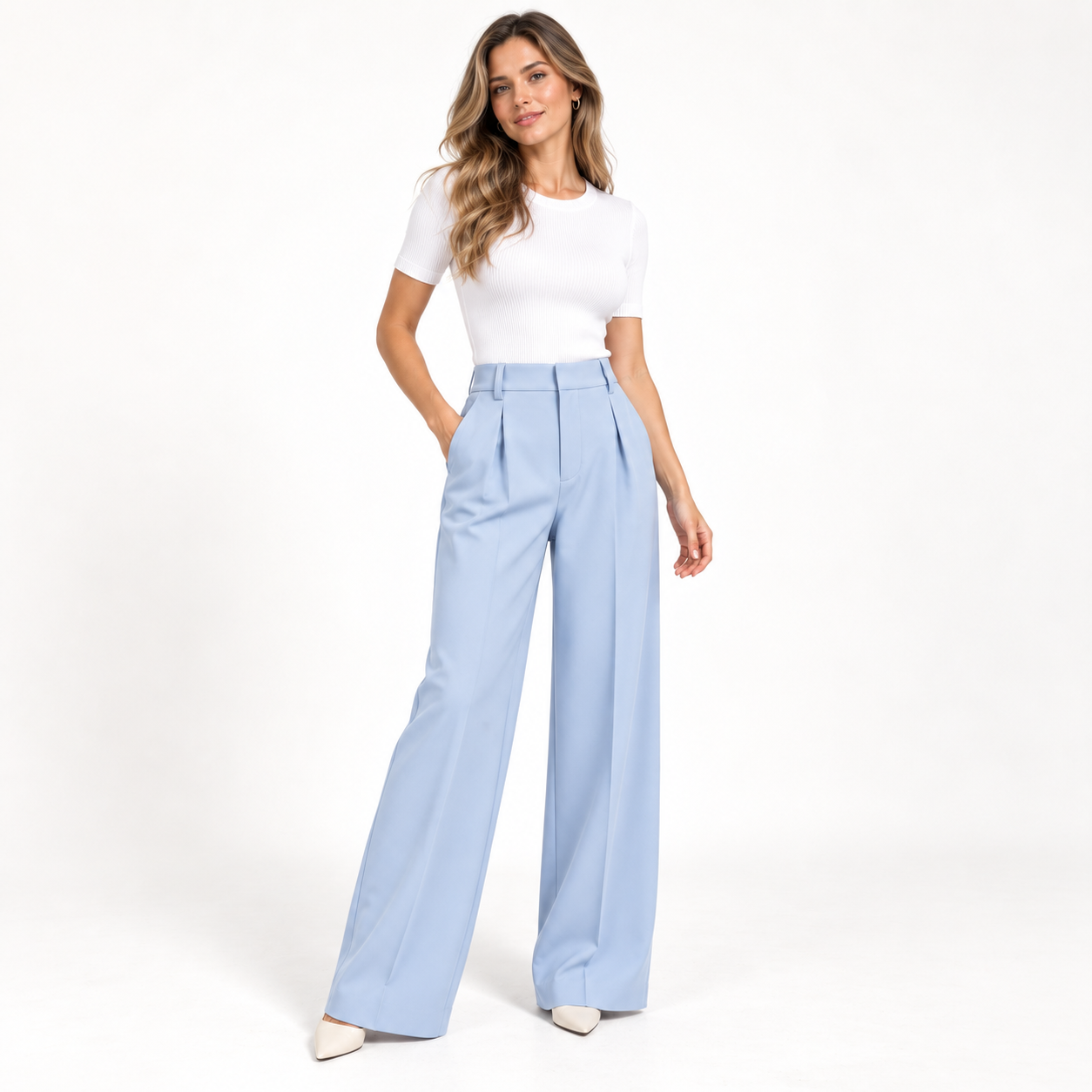 Female model wearing Light Blue pleated wide-leg dress pants in a clean studio, natural front pose