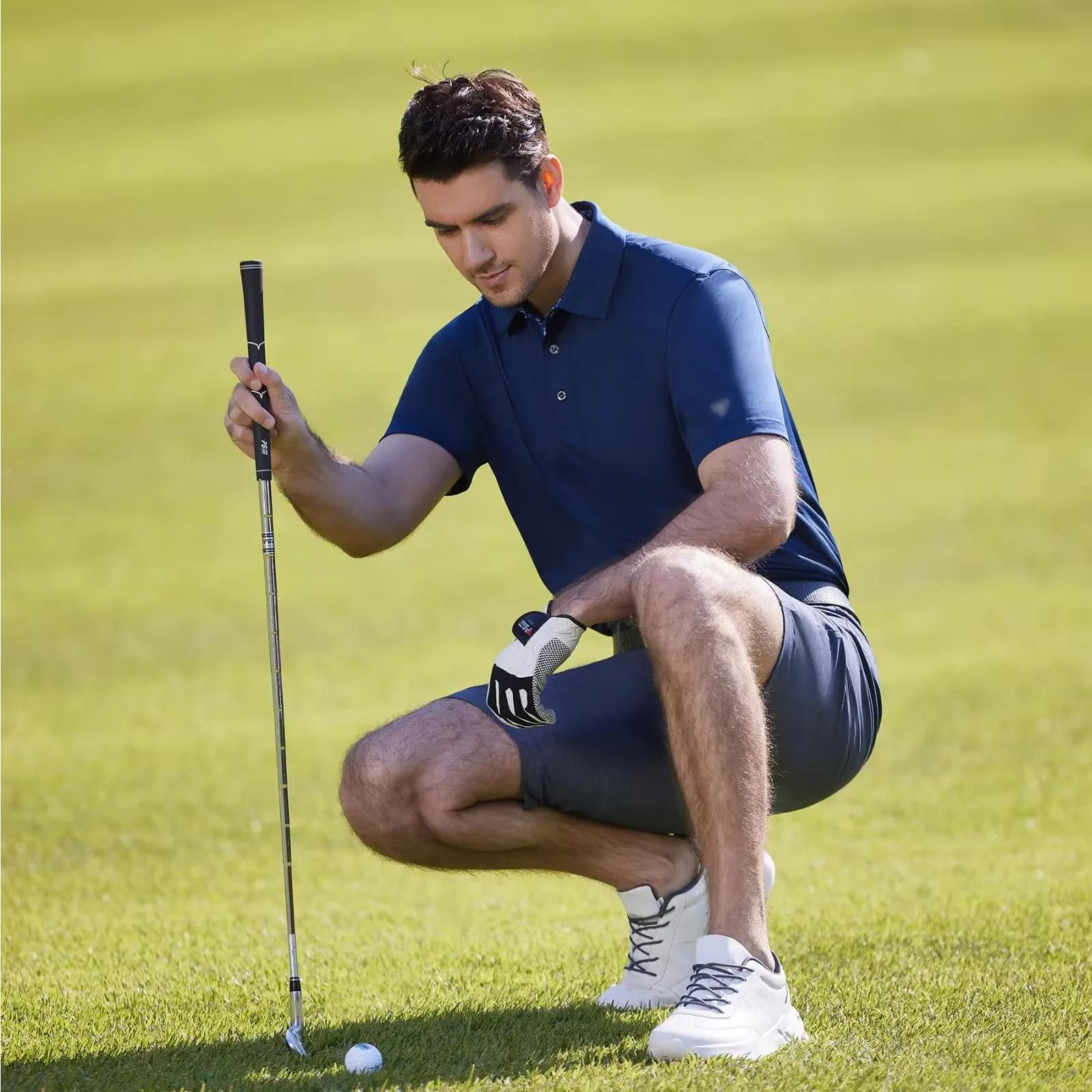 Man wearing navy short sleeve performance golf polo on a golf course