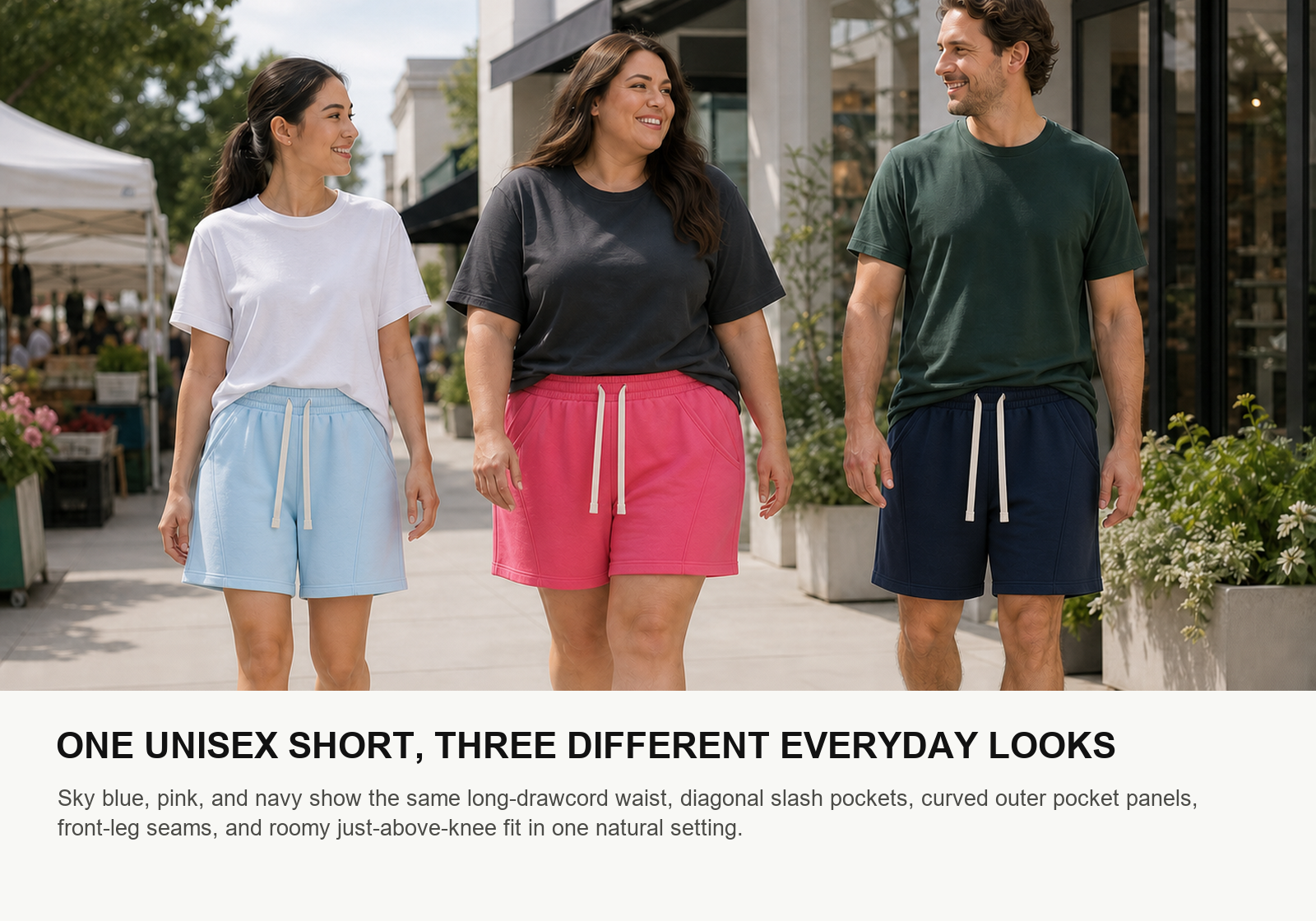Two women and one man wearing sky blue pink and navy unisex cotton jersey lounge shorts at a weekend market