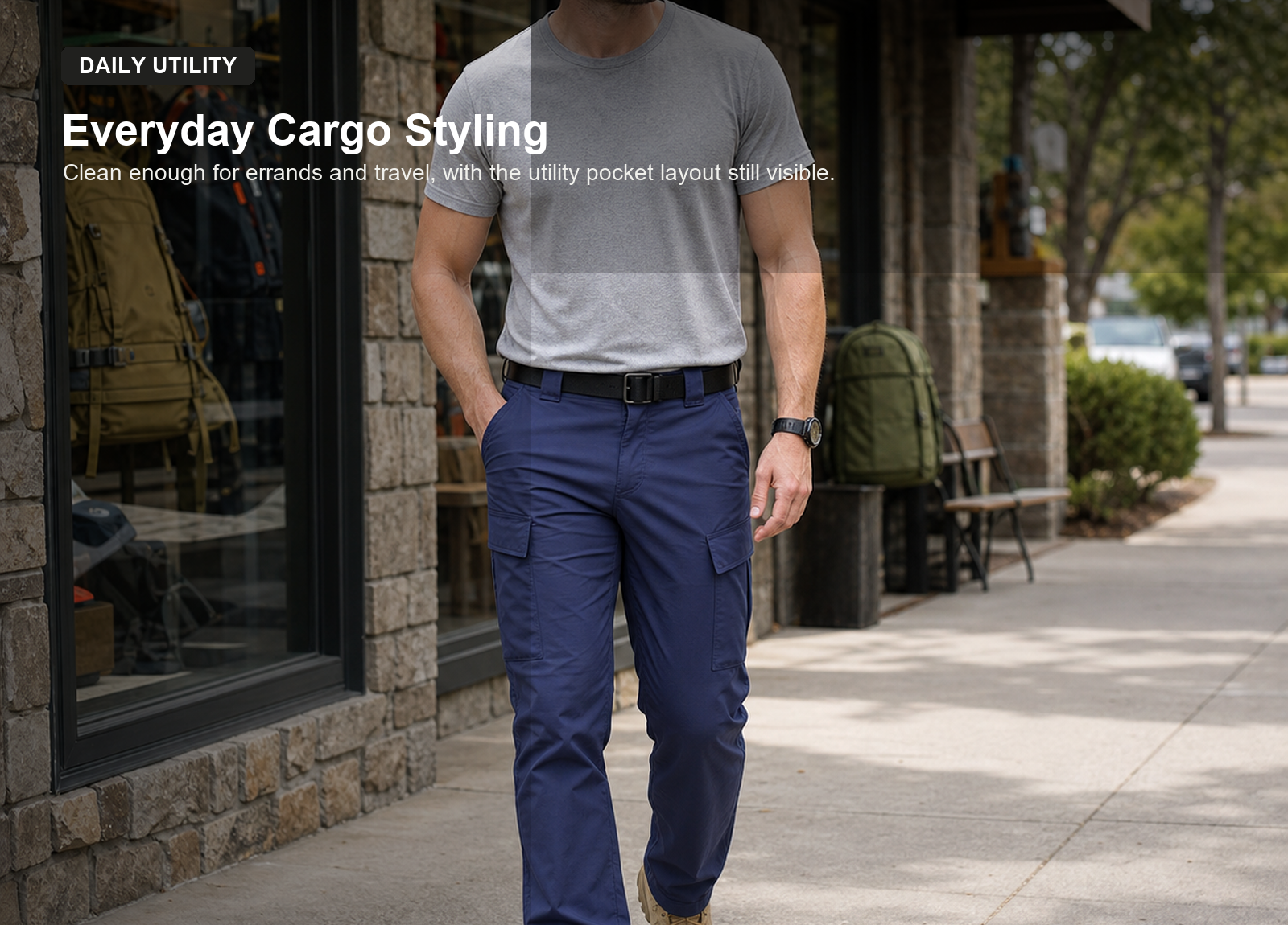 Man wearing navy water resistant ripstop cargo pants in an everyday outdoor store scene