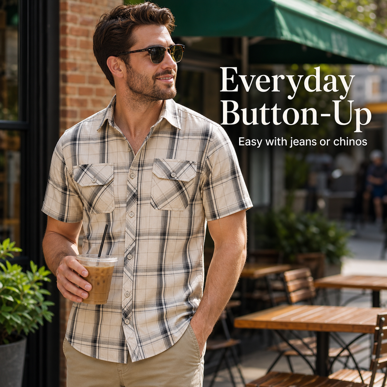 Man wearing a cream plaid short sleeve button-up shirt outside a cafe for everyday casual wear