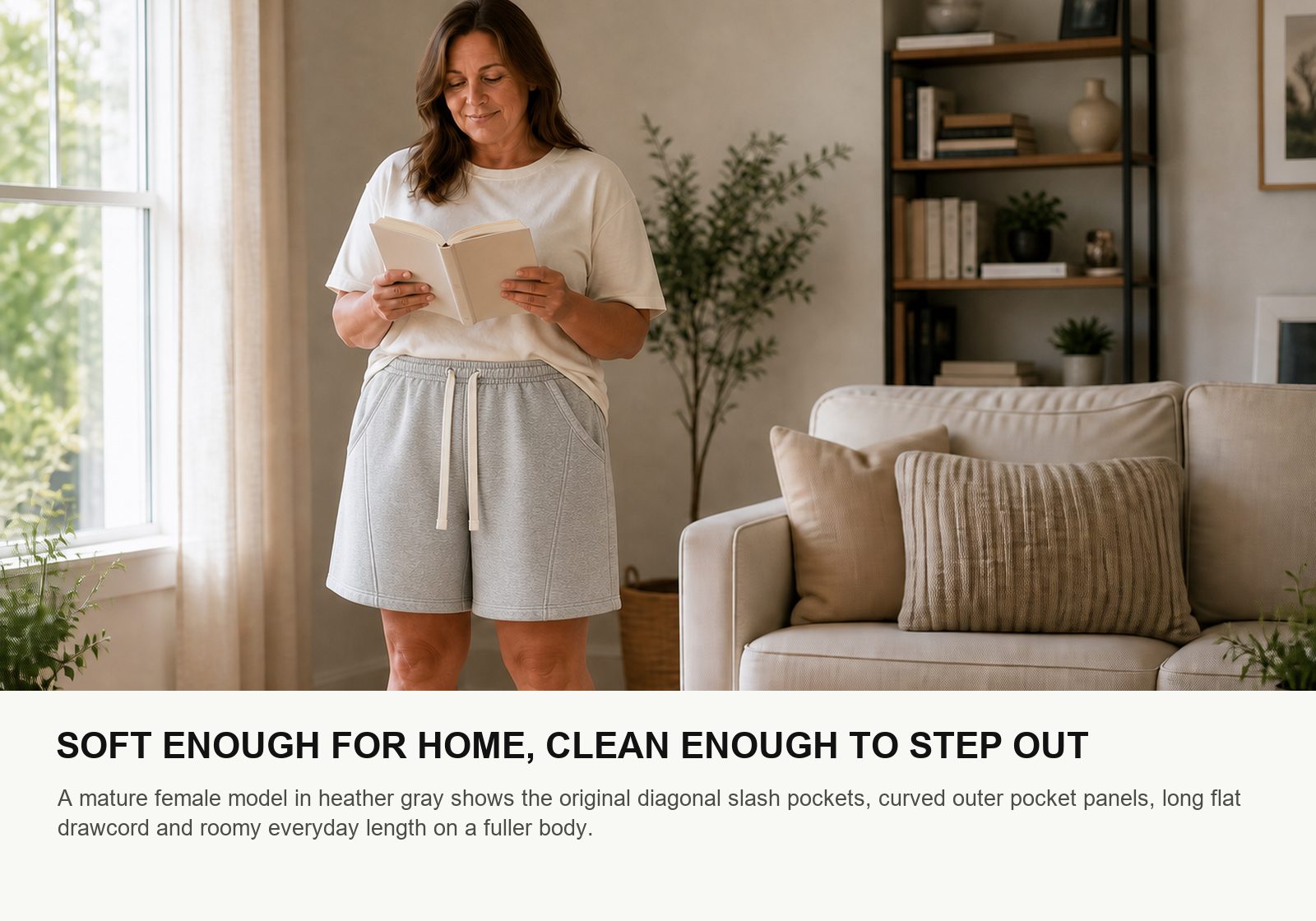 Woman wearing heather gray unisex cotton jersey lounge shorts in a bright home setting