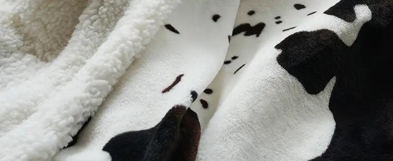 Cozy Cow Print Heated Throw Blanket