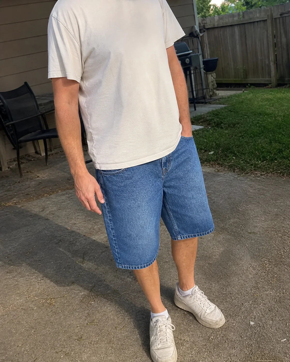 Everyday style reference featuring relaxed-fit knee-length denim shorts