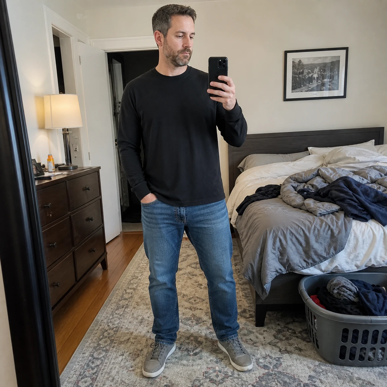 Black long sleeve crew-neck T-shirt in an everyday bedroom mirror photo