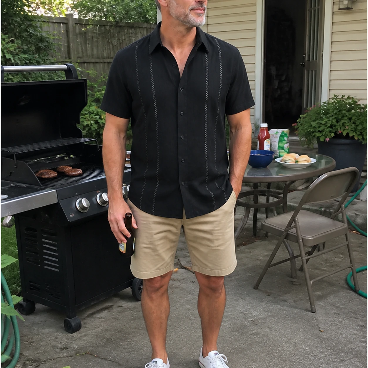 Black Cuban-inspired shirt in an everyday backyard patio photo
