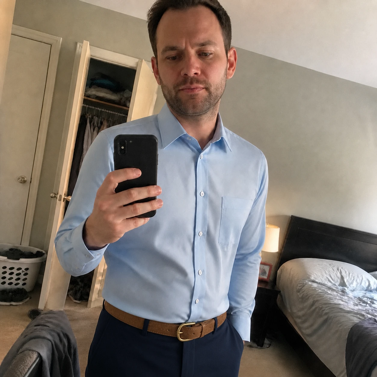 Casual phone snapshot of Light Blue dress shirt with navy trousers