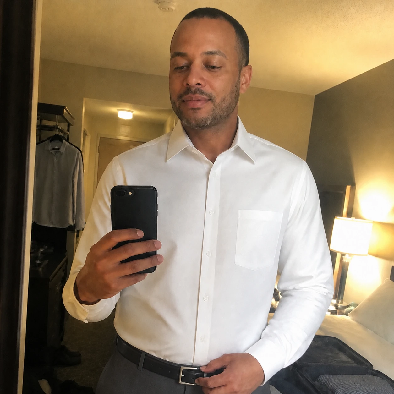 Casual phone snapshot of White dress shirt with charcoal trousers