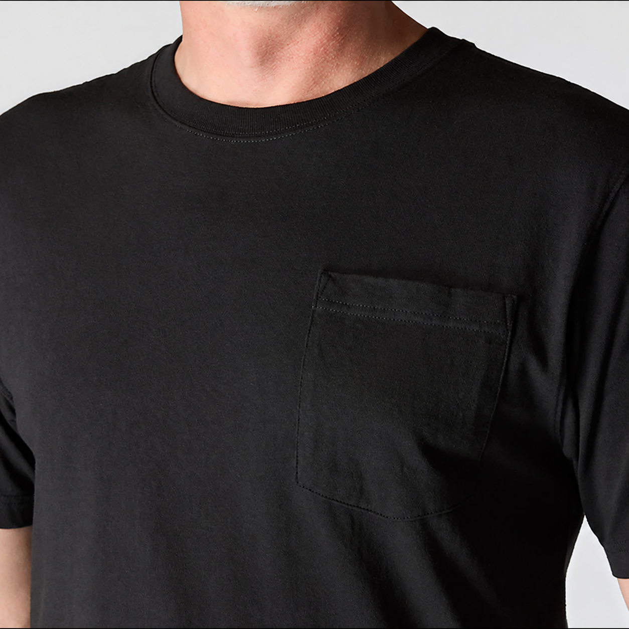 Rib-knit crewneck and chest pocket detail