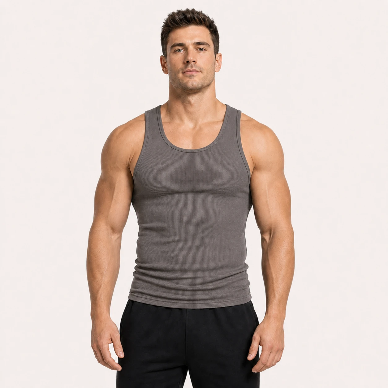 Front view of a fitness model wearing the Gray ribbed tank top