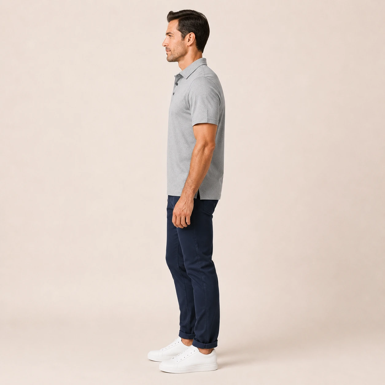 Side view of a model wearing the classic fit polo shirt