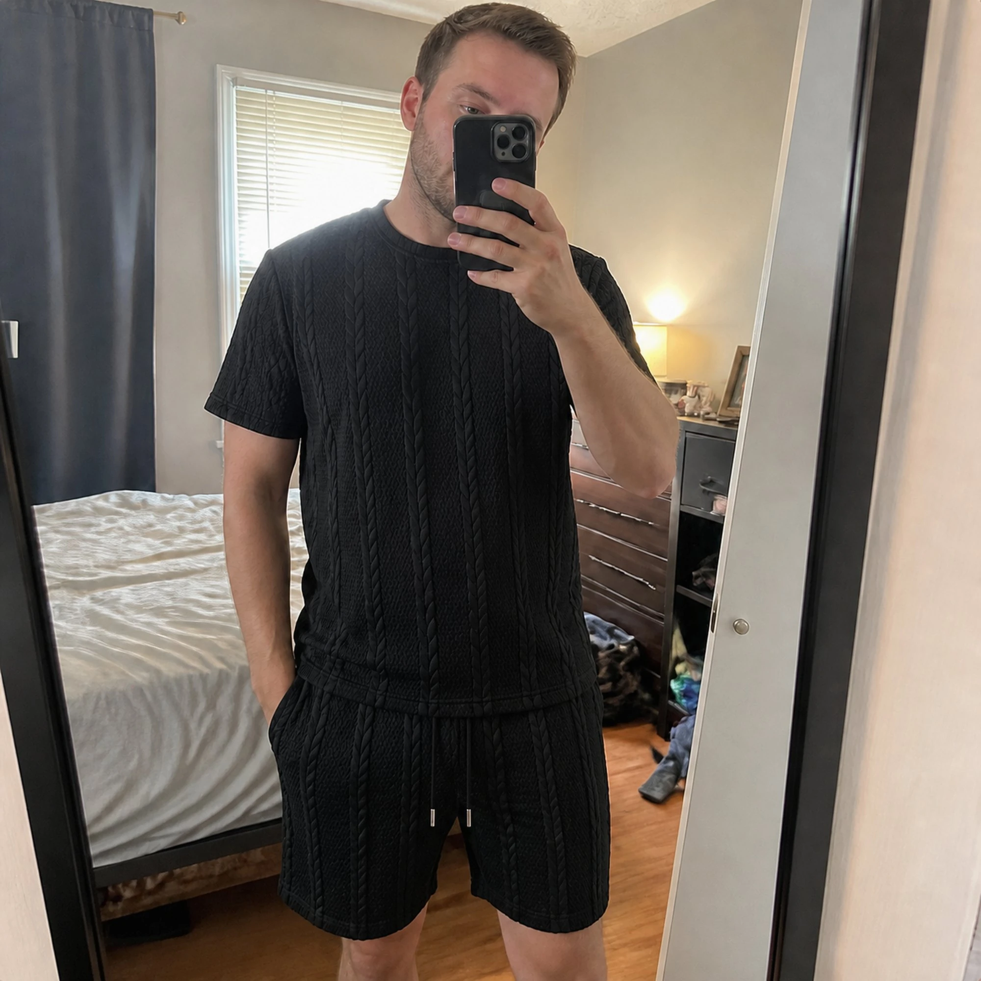 Casual phone snapshot of the matching set in a bedroom