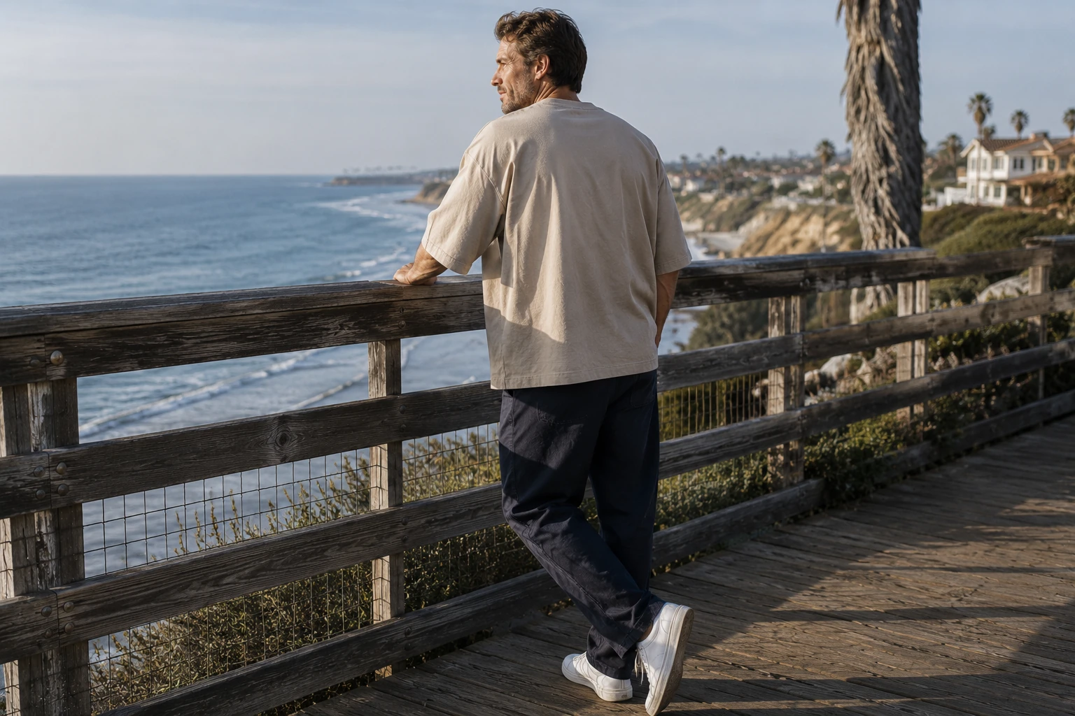 Desert Beige oversized T-shirt on a boardwalk