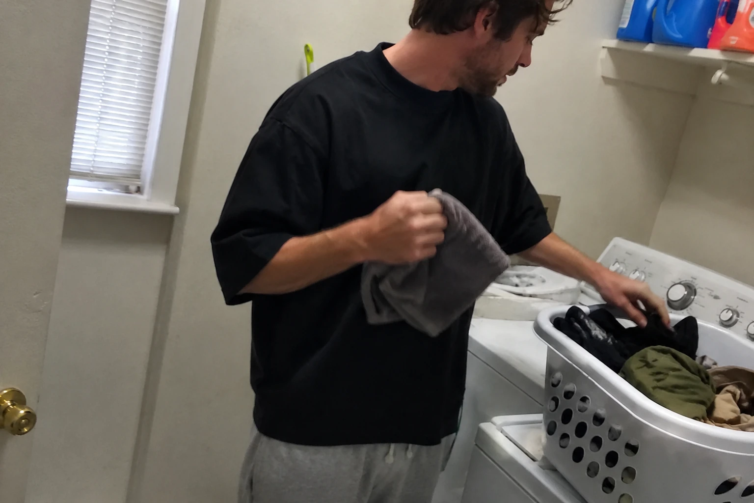 Casual phone snapshot of the Black oversized T-shirt