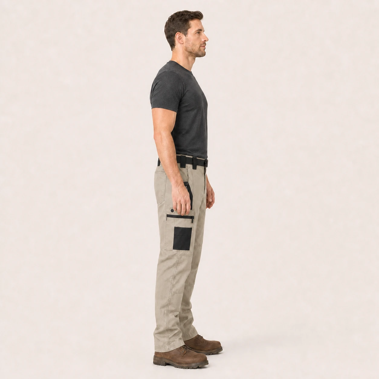 Side view of model wearing khaki tactical cargo pants