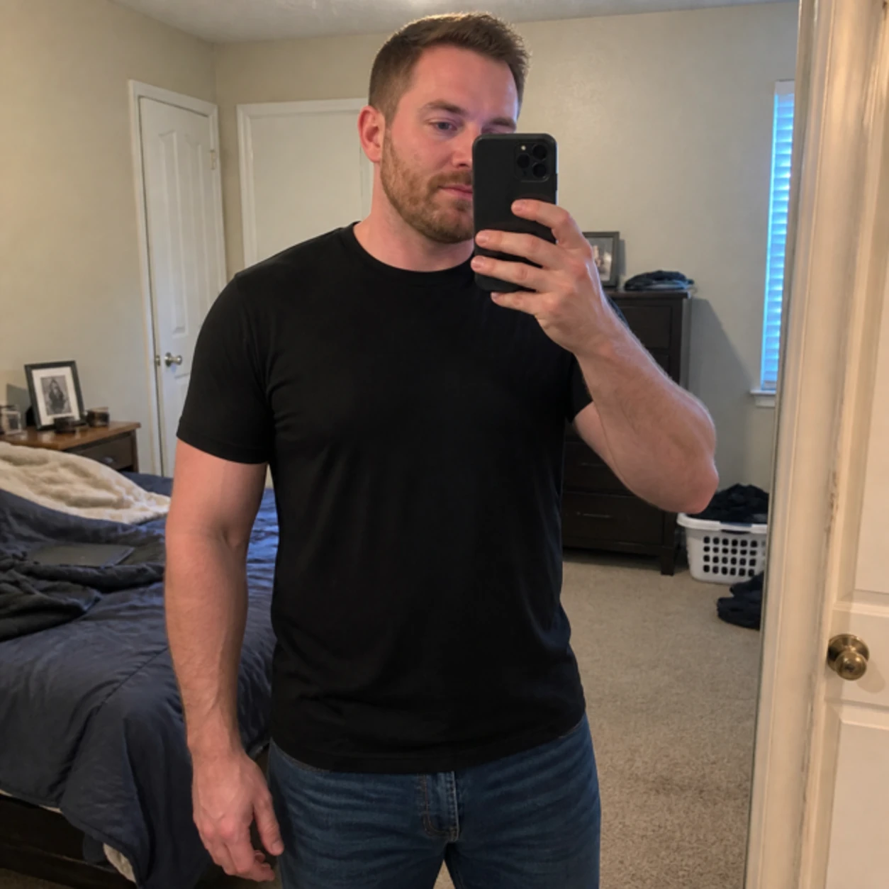 Casual phone snapshot of the athletic-fit T-shirt in everyday life