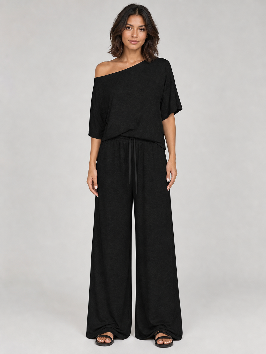 Women's black one-shoulder top and wide-leg pants set front view