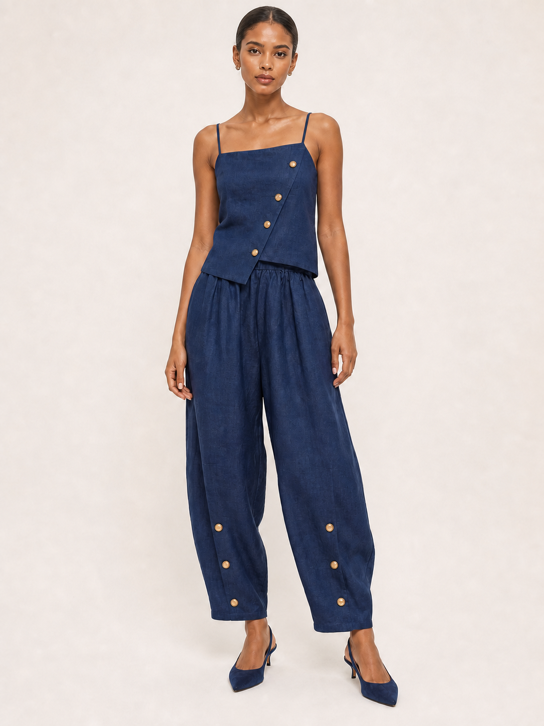 Women's navy asymmetric button camisole and tapered pants set front view