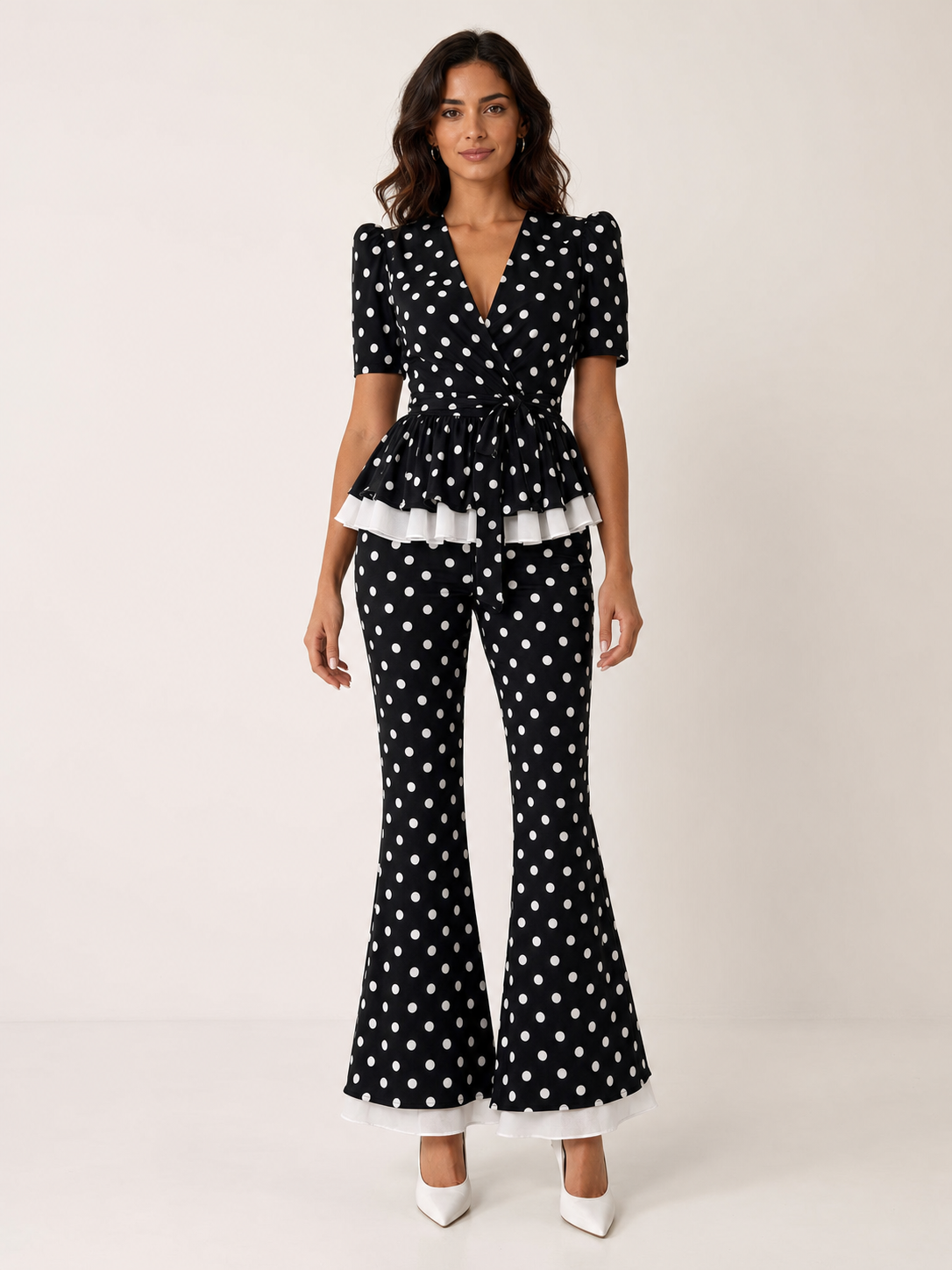 Women's black polka dot peplum top and flare pants set front view