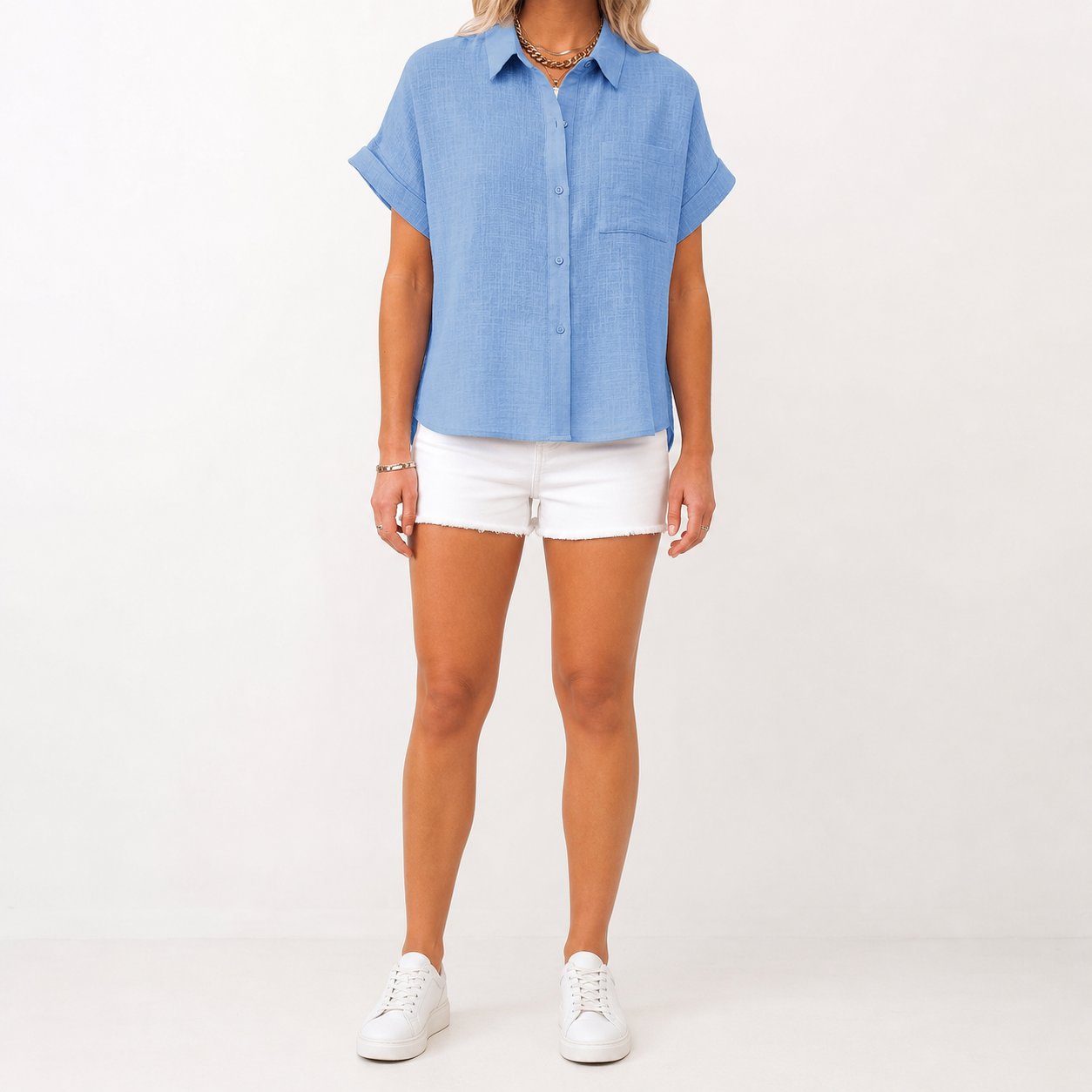 Light chambray blue women's textured short-sleeve button shirt front view
