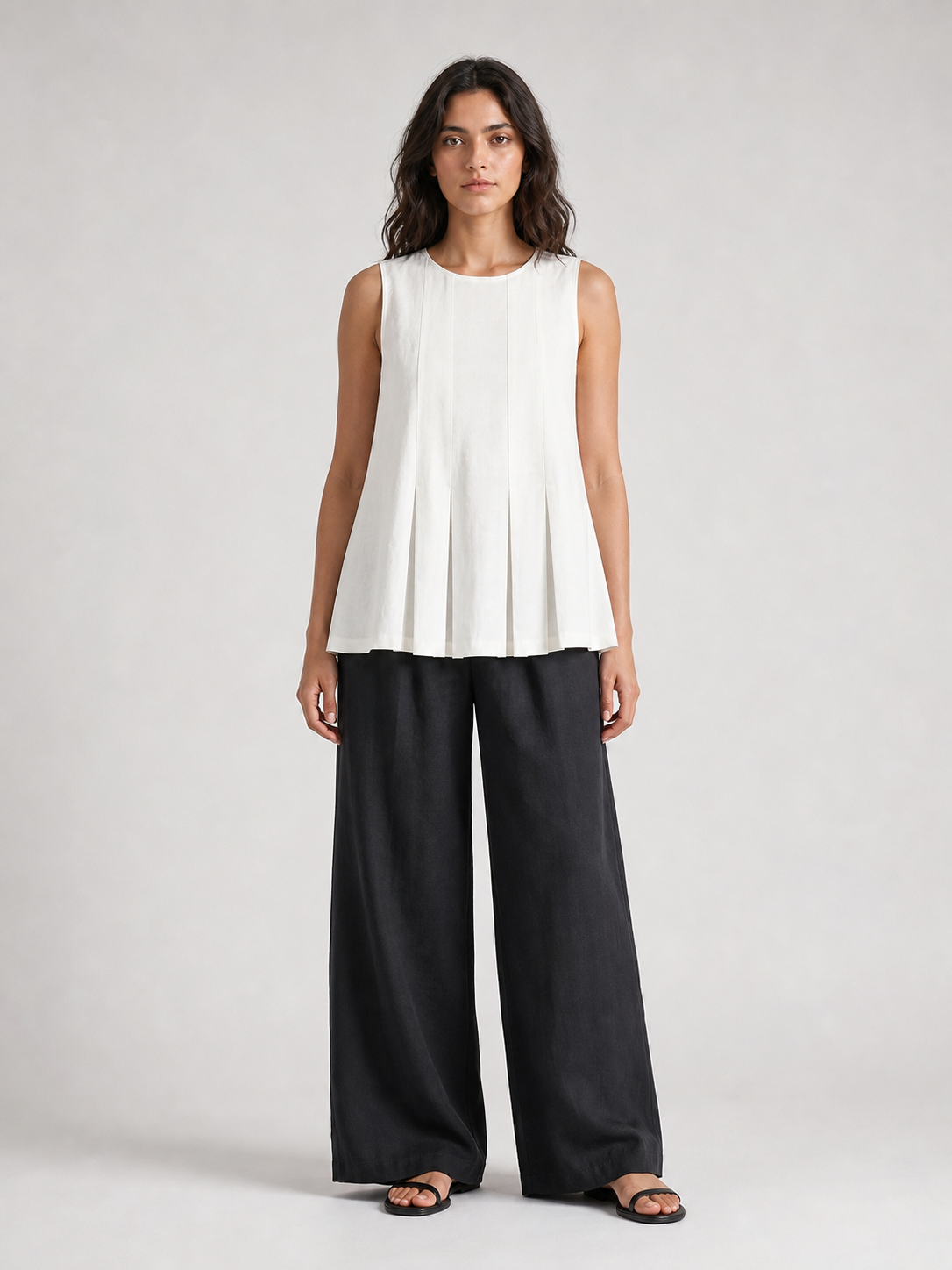 Women's soft white pleated sleeveless A-line top front view