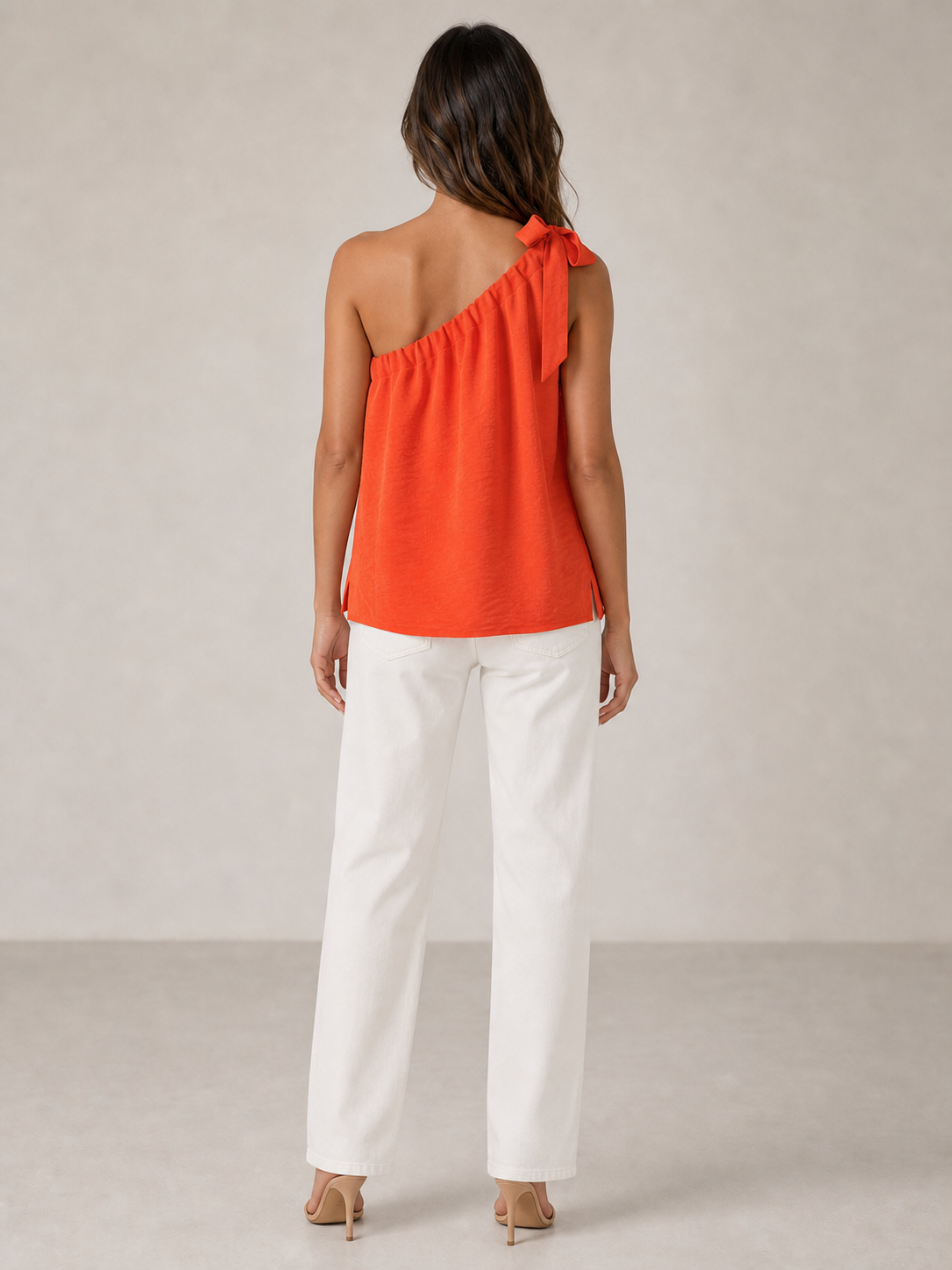 Women's coral orange one-shoulder tie loose top back view