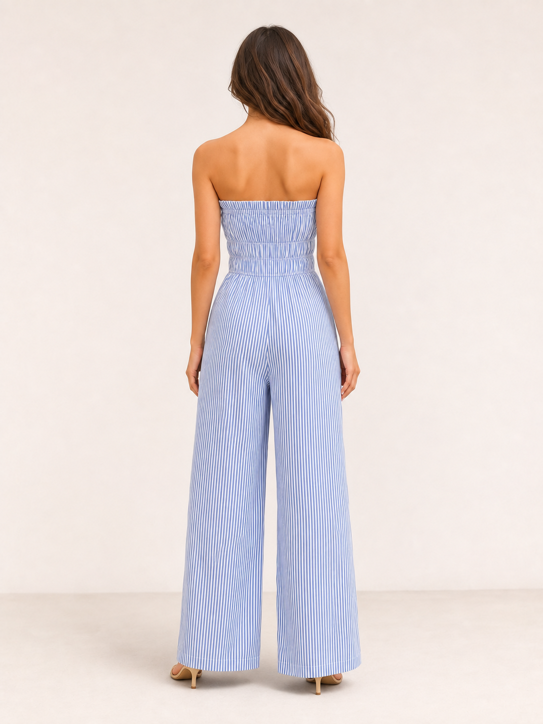 Women's blue and white striped strapless wide-leg jumpsuit back view