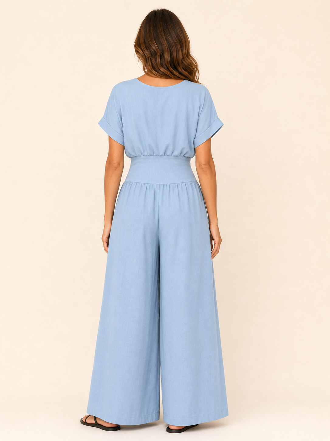 Women's light blue surplice high-waist wide-leg jumpsuit back view