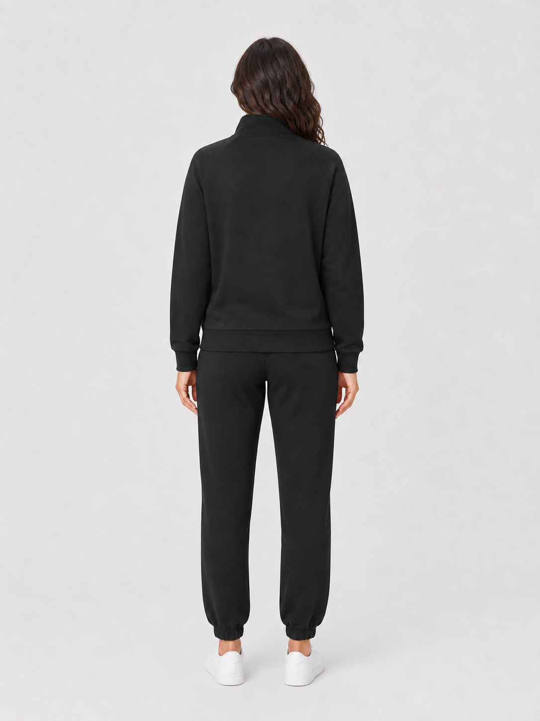 Women's black full-zip jacket and tapered jogger set back view