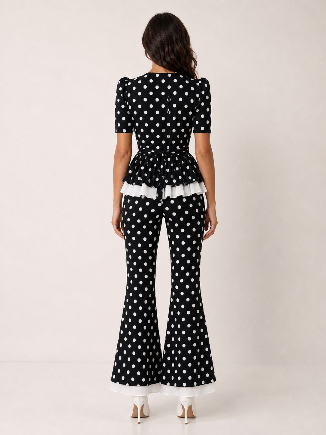 Women's black polka dot two-piece flare pants set back view