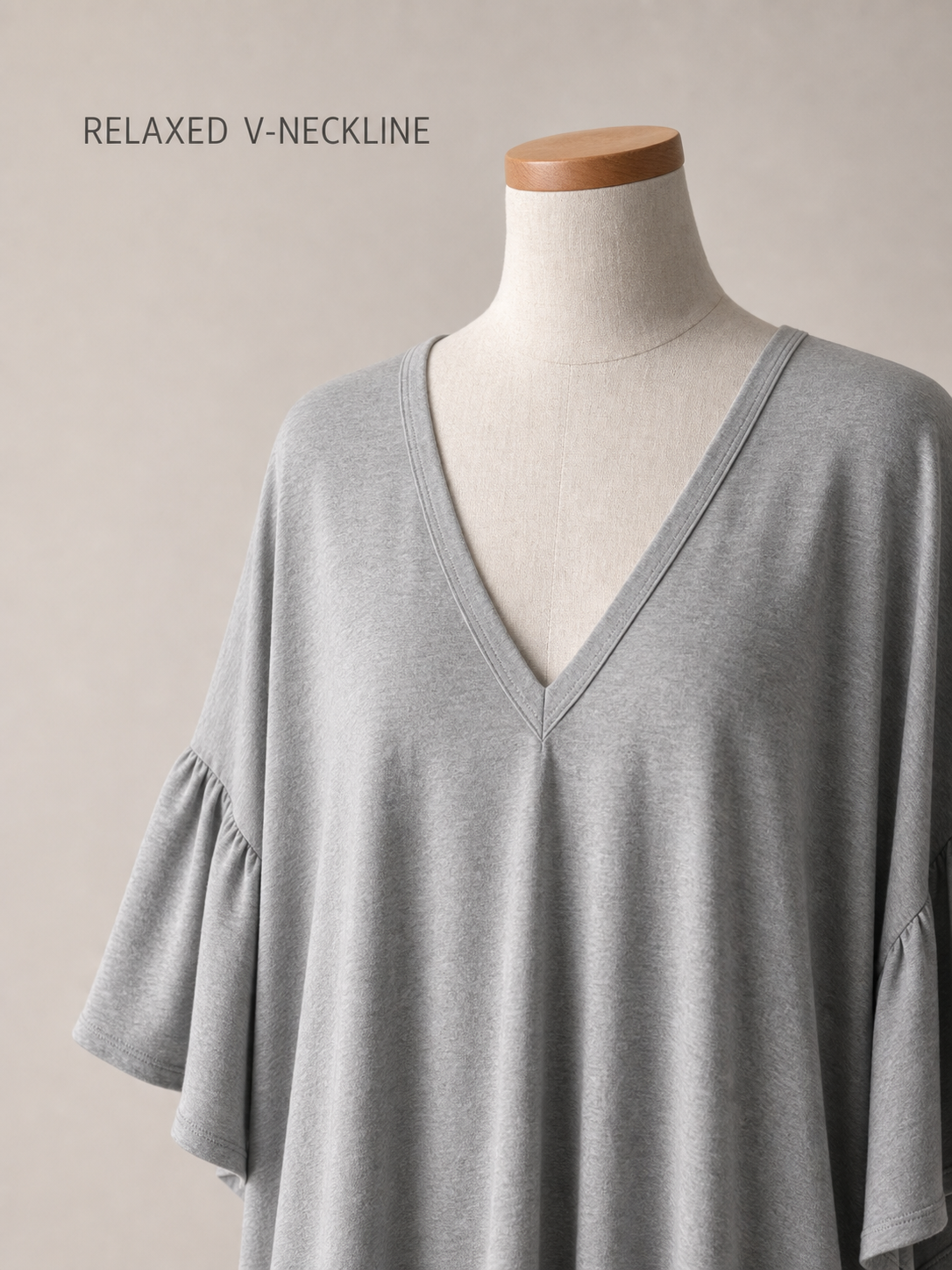 Relaxed V-neckline and dropped shoulder detail