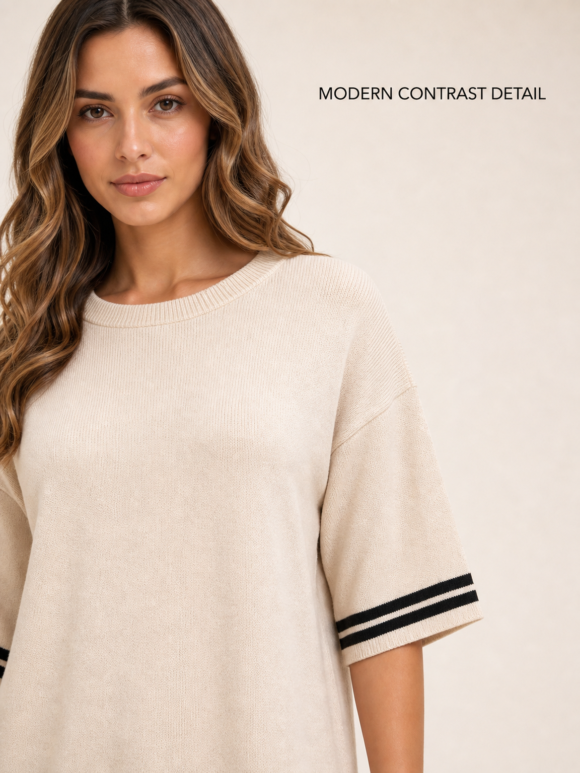 Crew neckline and black striped sleeve trim detail