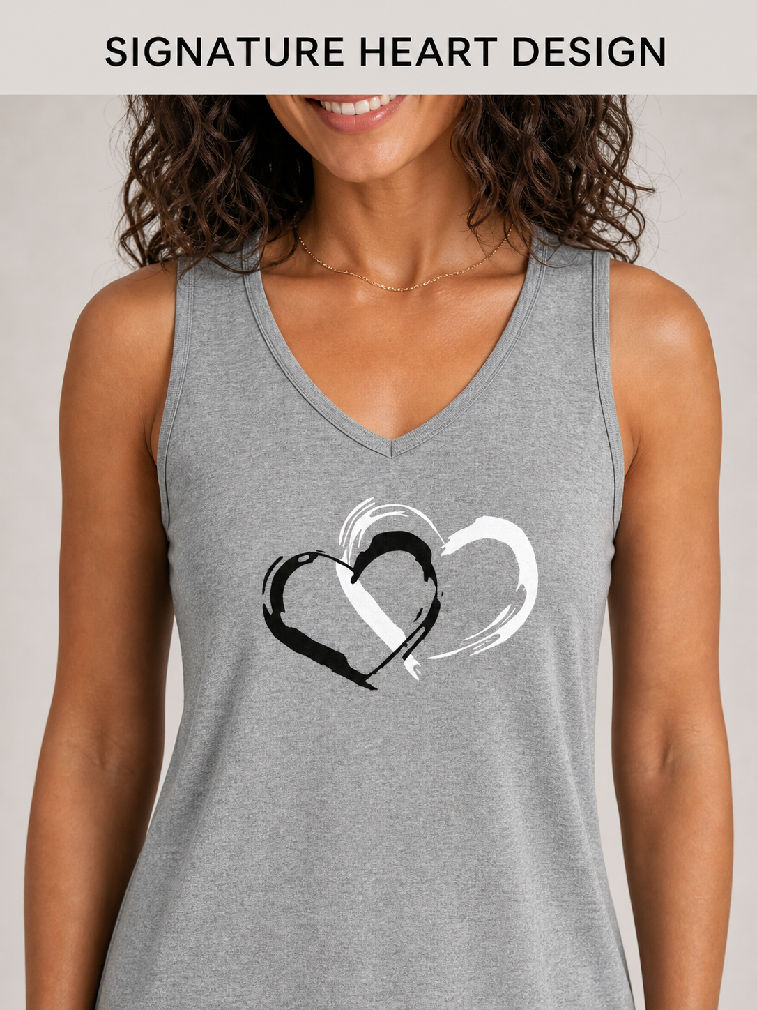 Double brushstroke heart graphic and bound V-neck detail