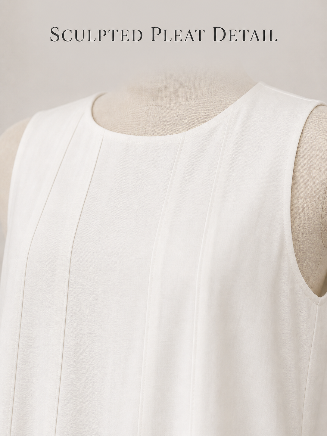 Round neckline sleeveless armhole and vertical tuck detail