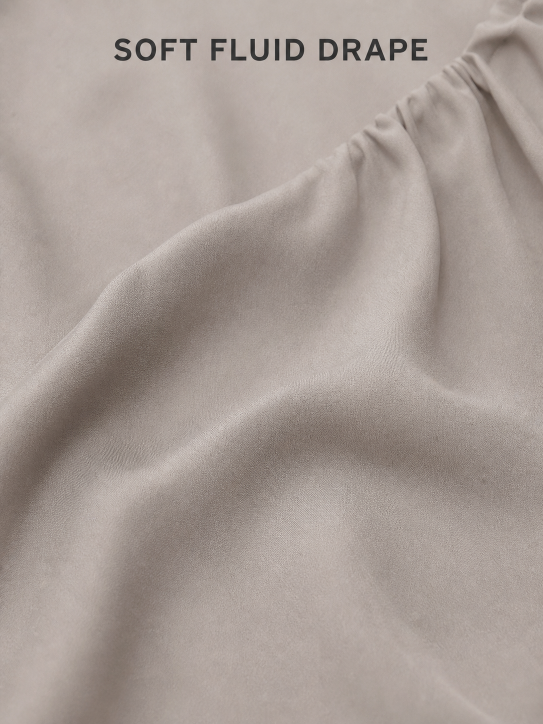 Soft fluid taupe woven fabric drape close-up