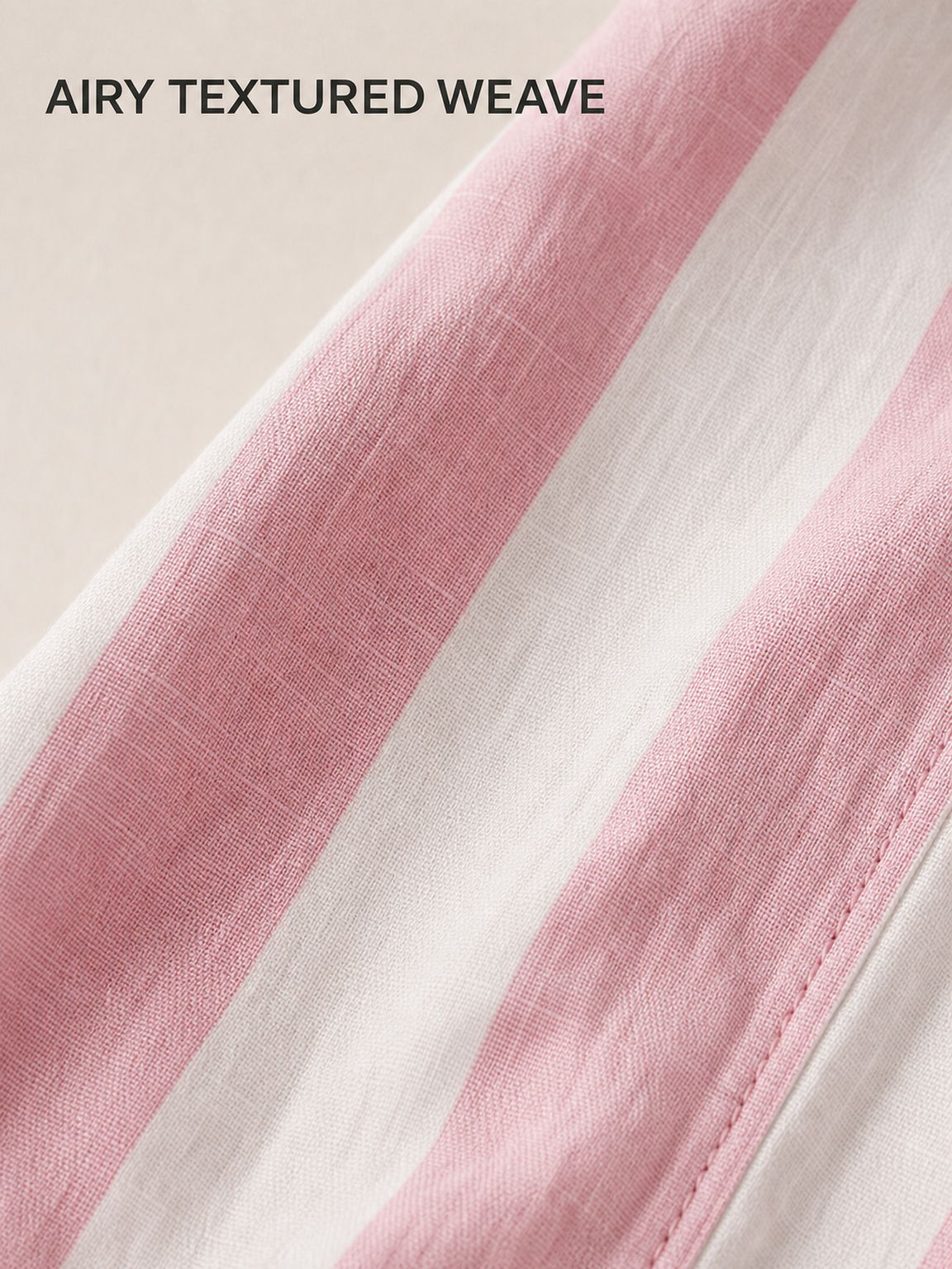 Pink and white airy textured woven fabric close-up