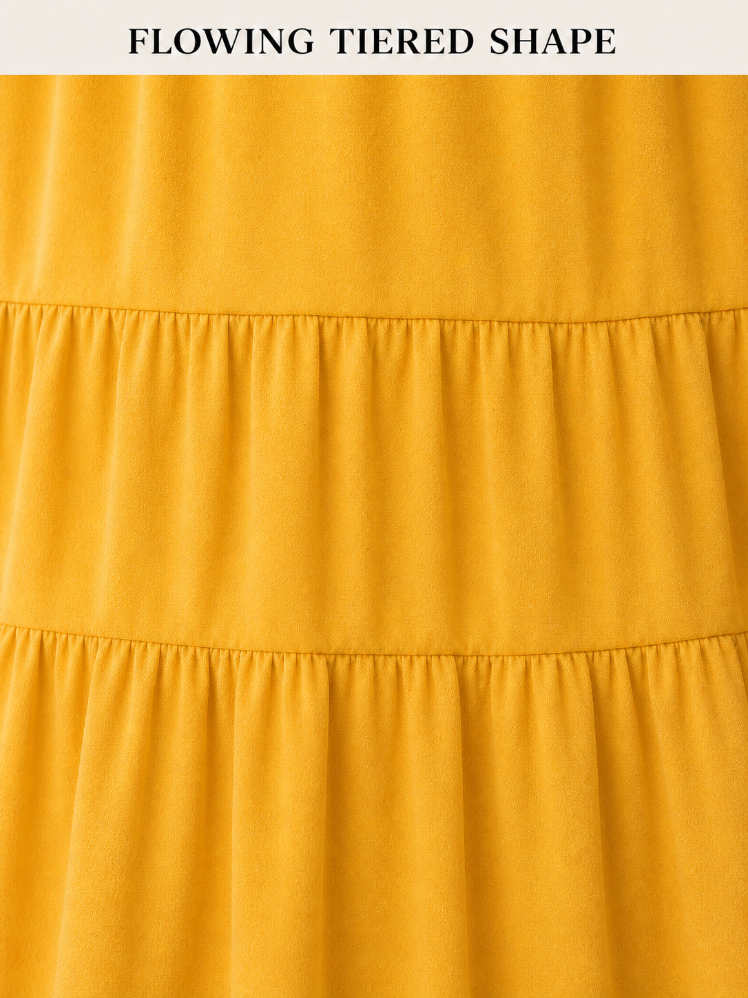 Flowing gathered tier seam craftsmanship