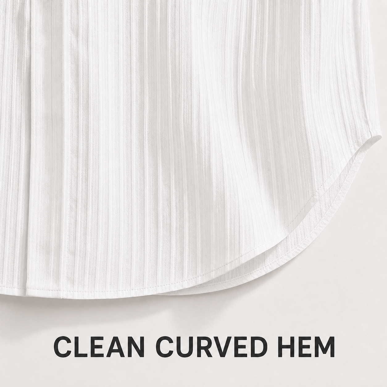 Clean curved shirttail hem and stitching detail