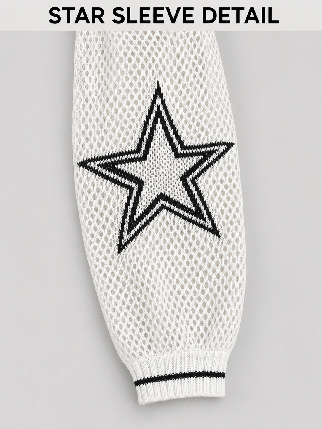 Black star sleeve and striped cuff detail