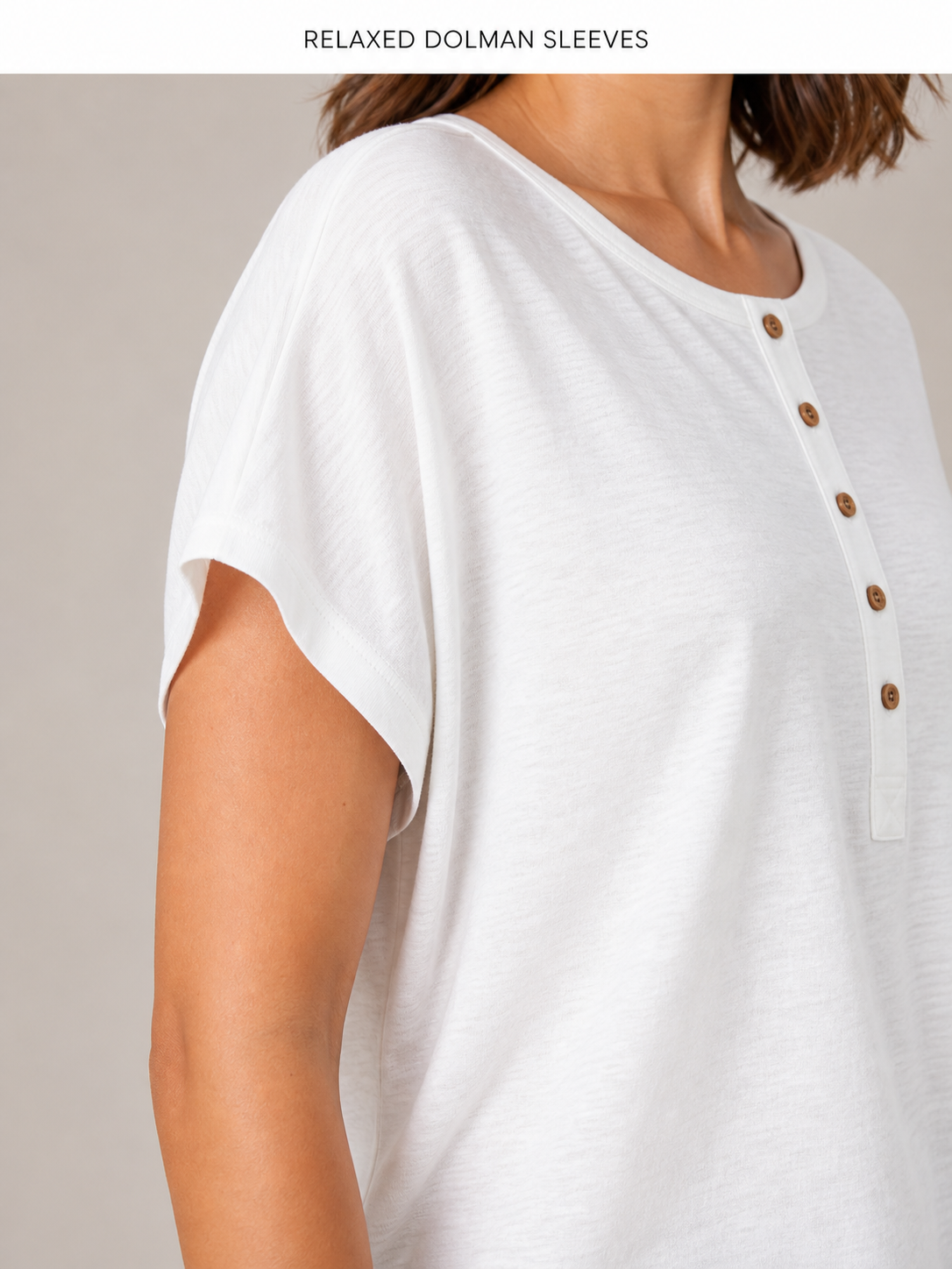 Relaxed integrated dolman sleeve and clean edge stitching