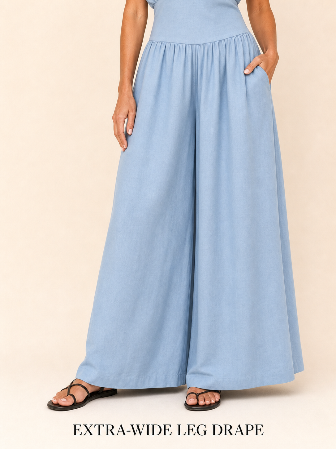 Extra-wide full-length trouser leg drape and finished hem detail