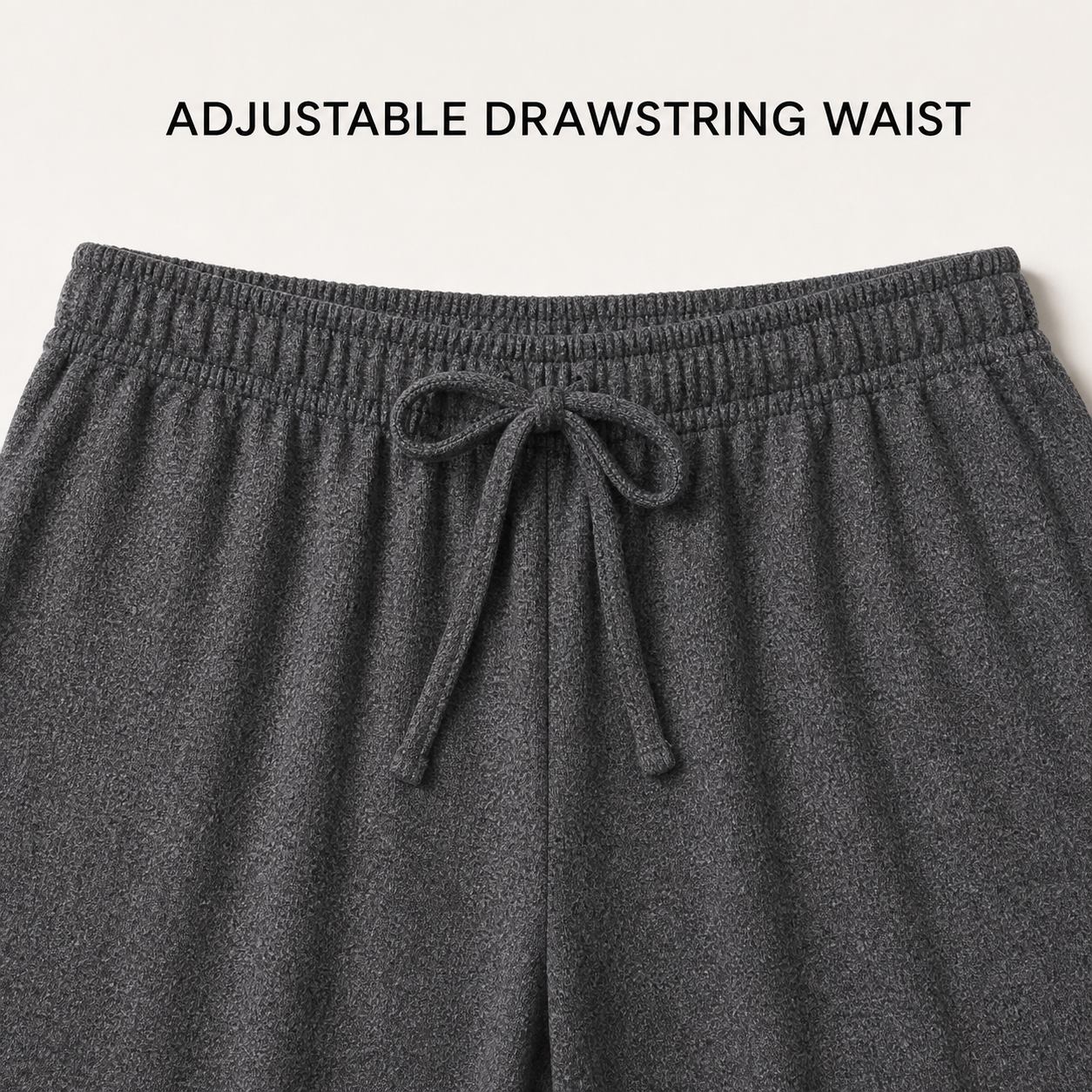 Gathered elastic waistband and centered drawstring construction detail