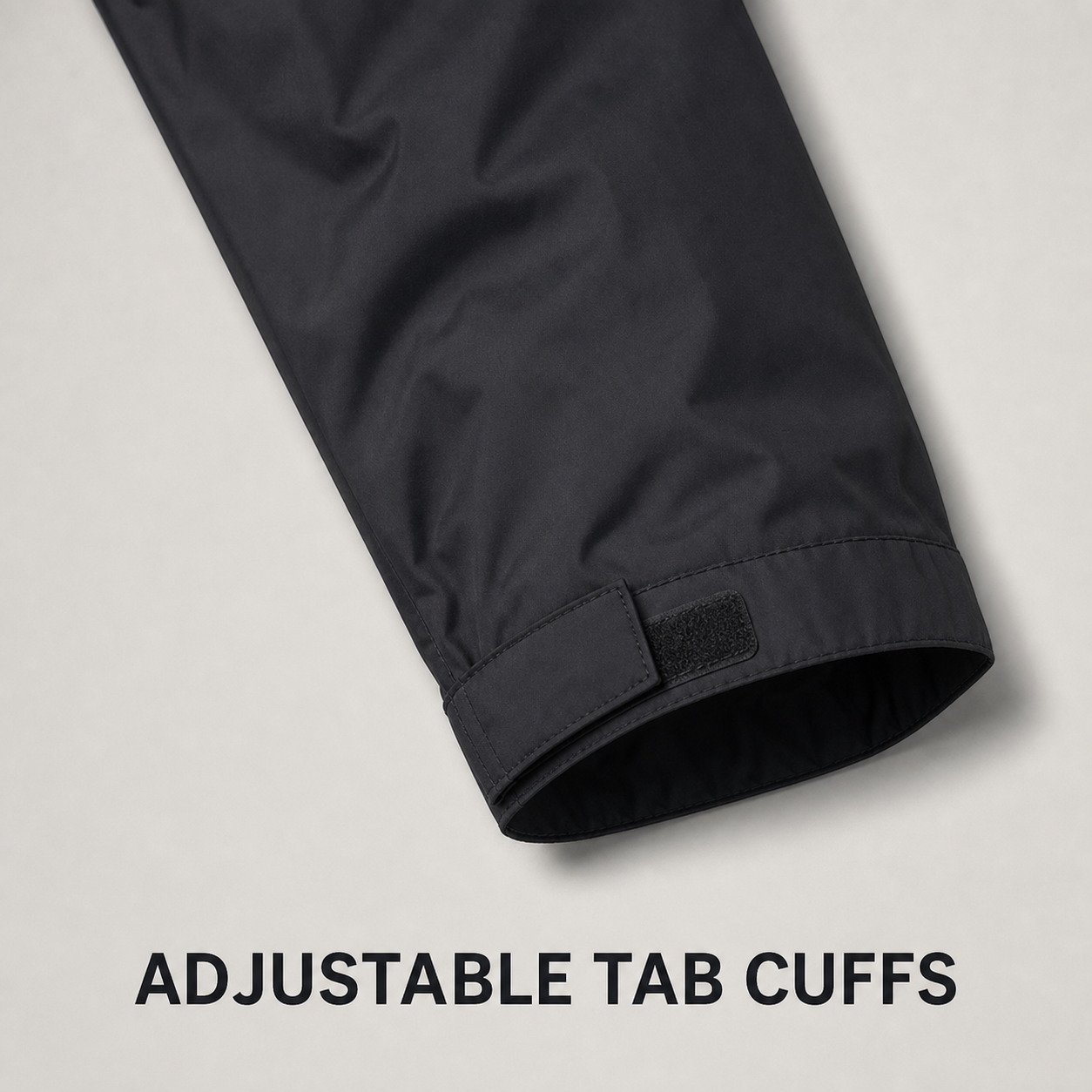 Adjustable tab cuff construction detail