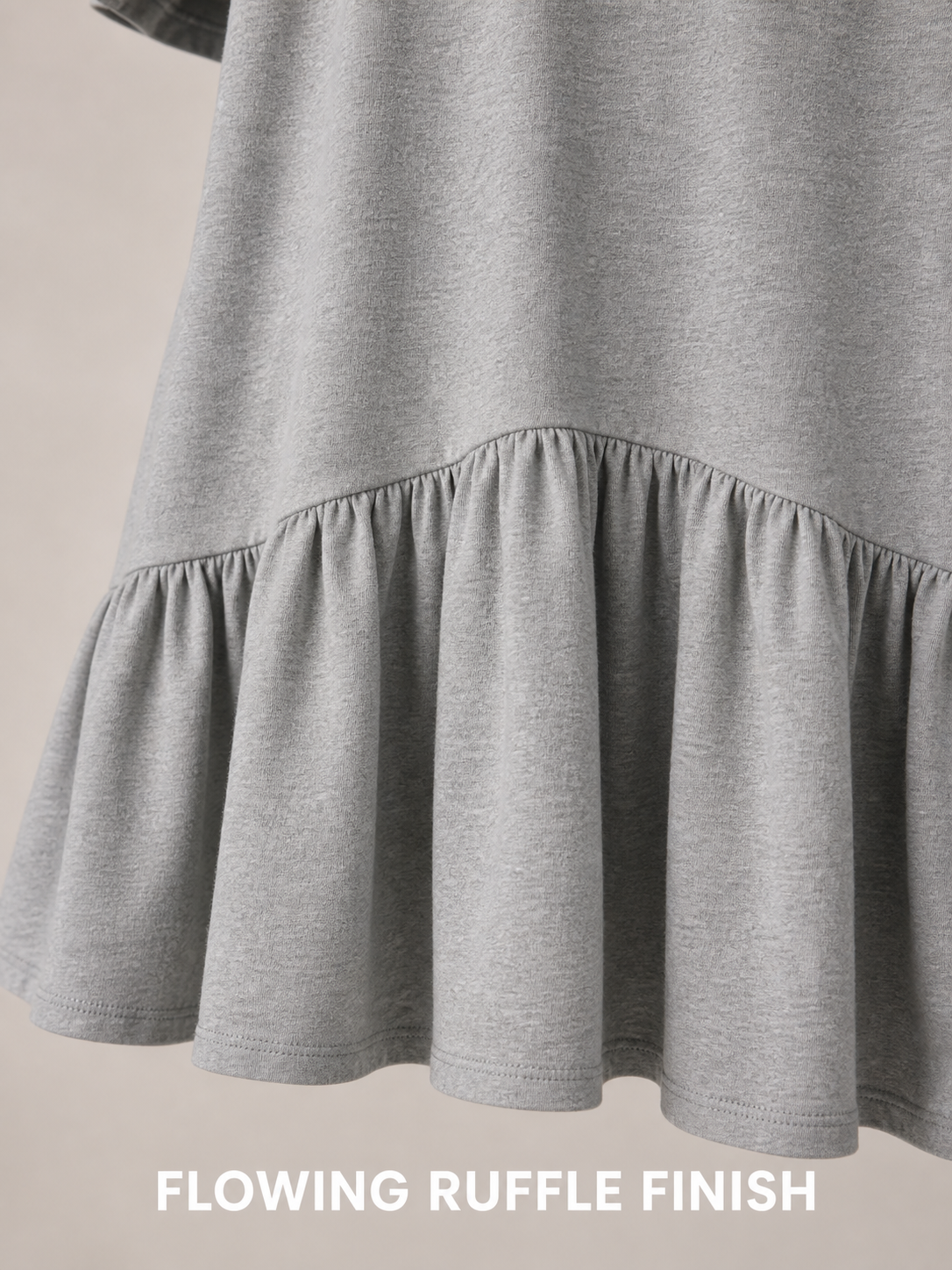 Flowing gathered drop-waist ruffle finish