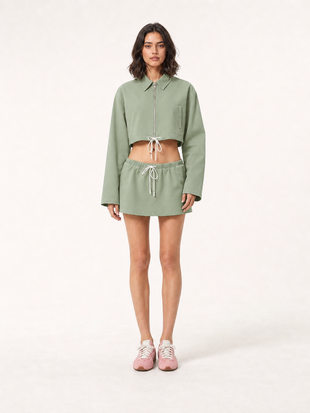Women's cropped zip jacket and mini skirt set in muted sage