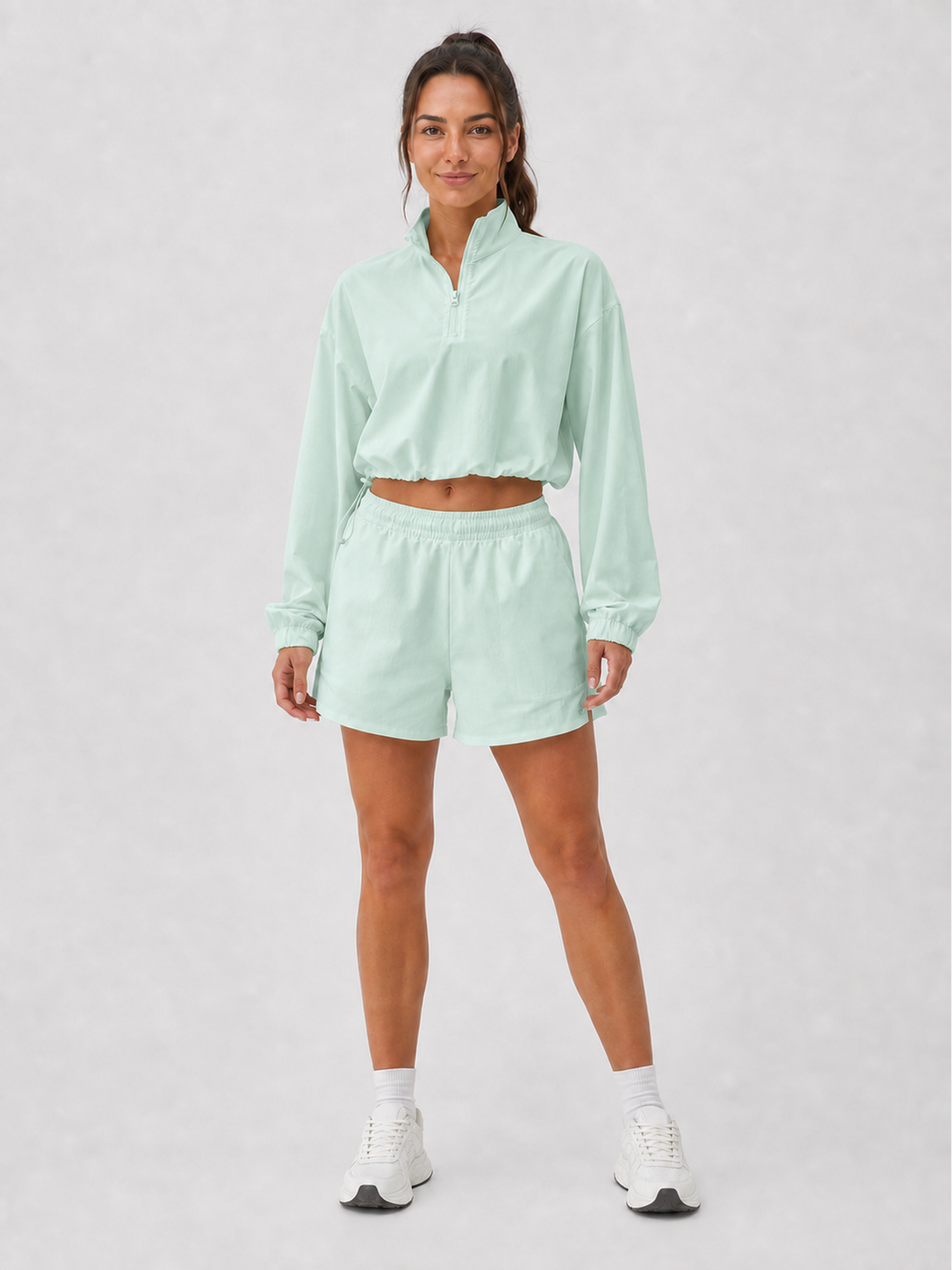 Women's mint green half-zip pullover and shorts set