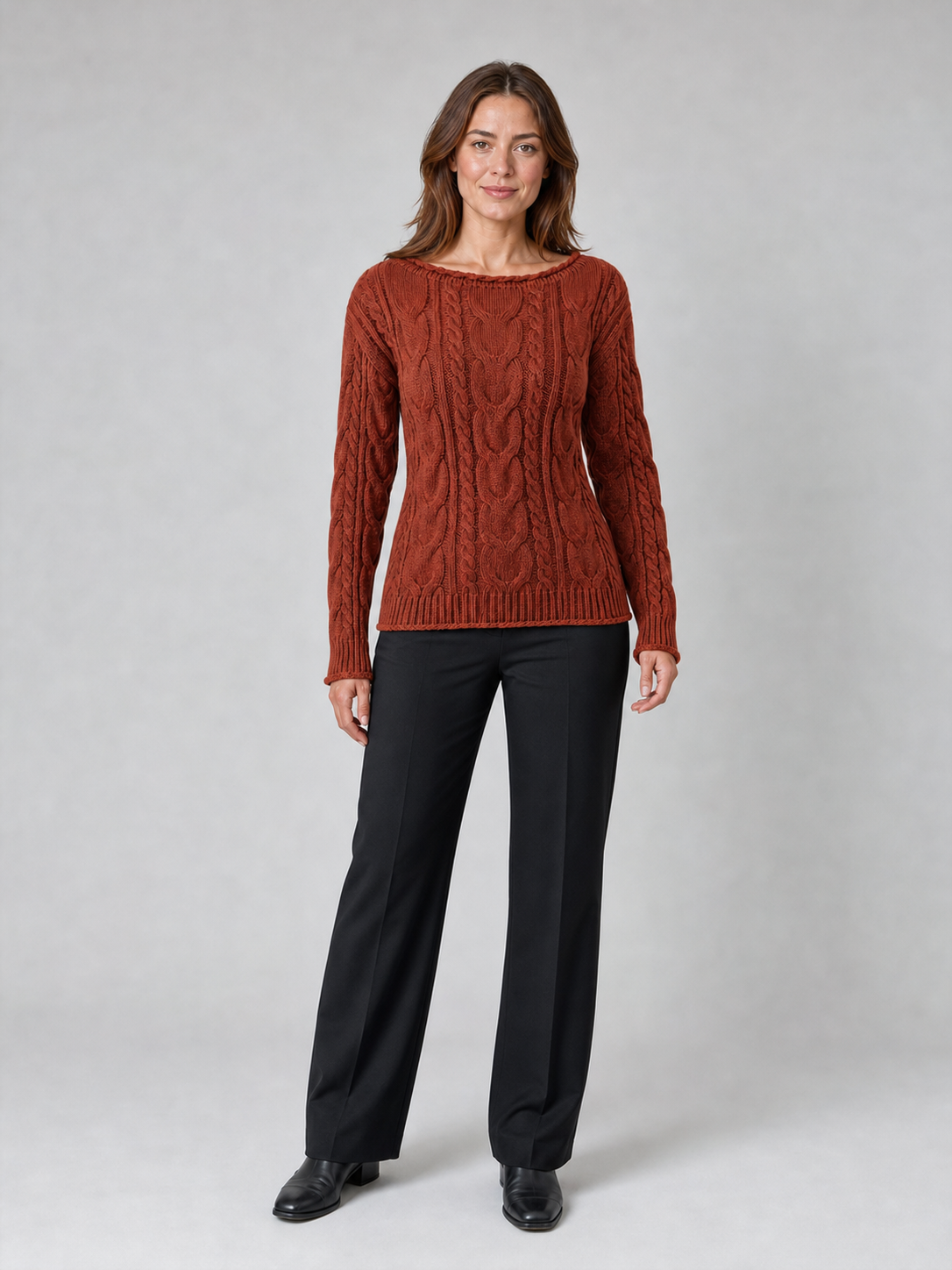 Women's cable knit sweater in warm rust