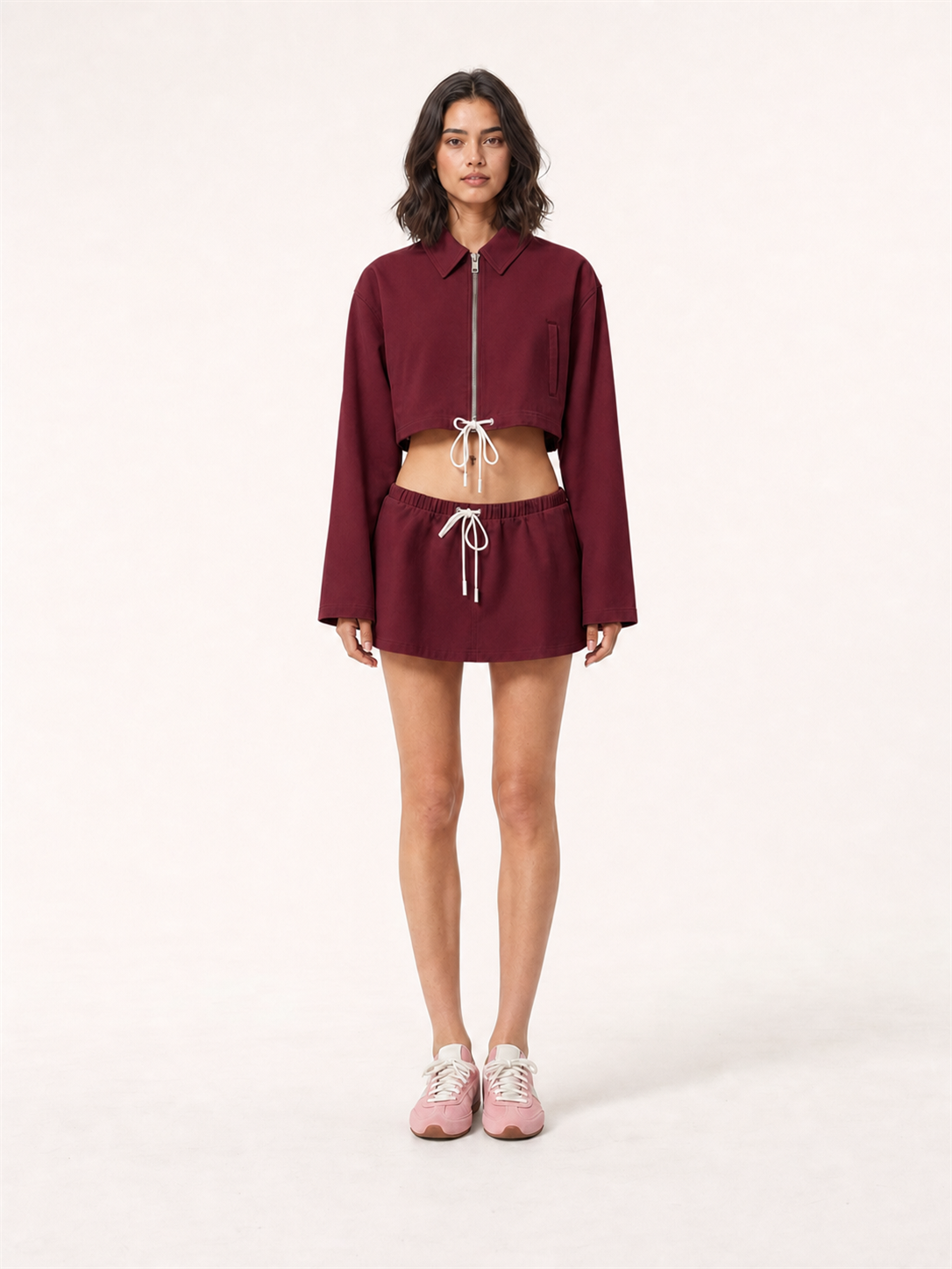 Women's cropped zip jacket and mini skirt set in burgundy