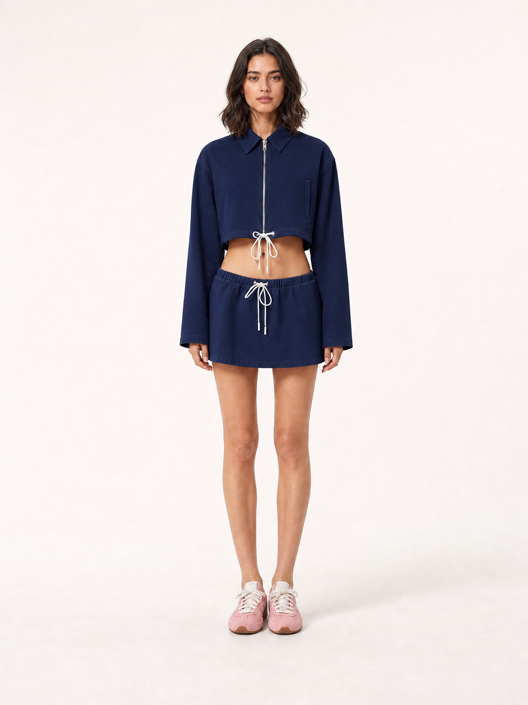 Women's cropped zip jacket and mini skirt set in deep navy